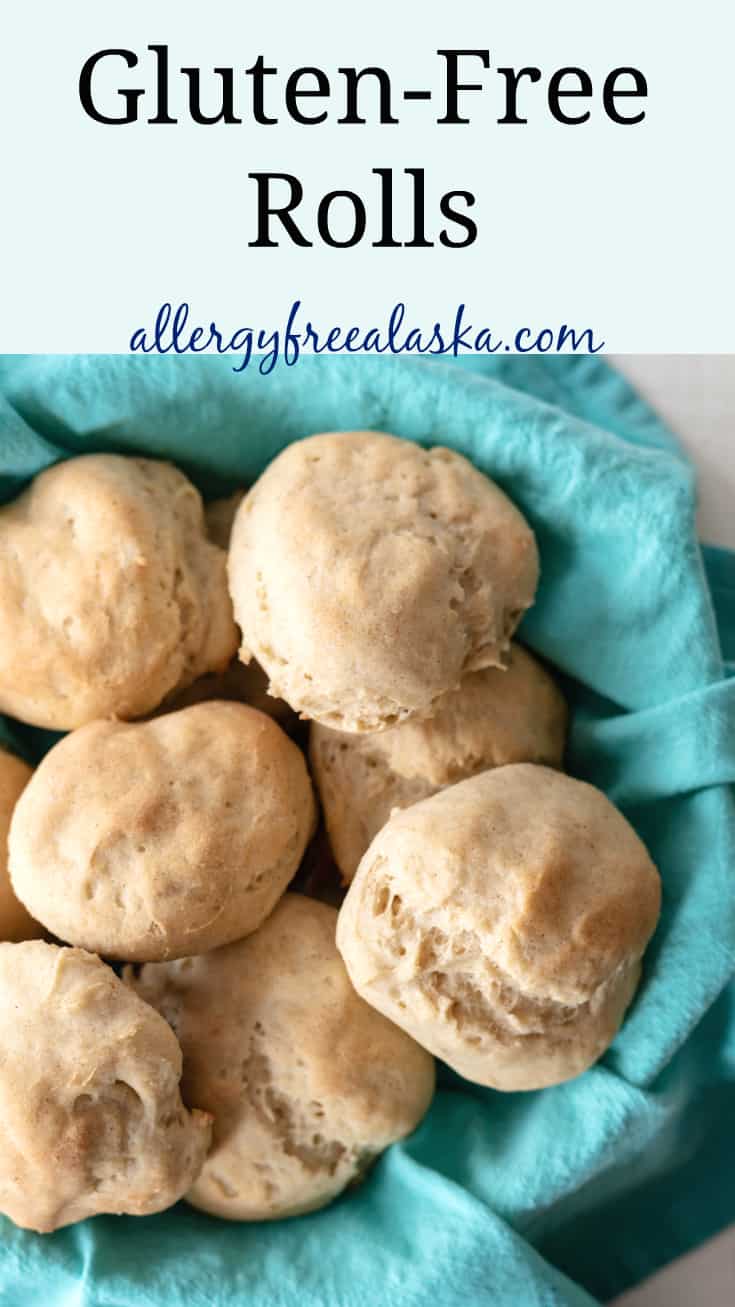 pinterest pin with picture of gluten-free rolls in basket lined with blue napkin. Text says gluten-free rolls, allergyfreealaska.com