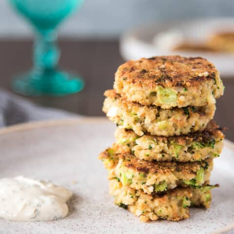 tuna patties stacked on plate side view