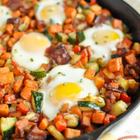 a sweet potato breakfast hash in a cast iron skillet