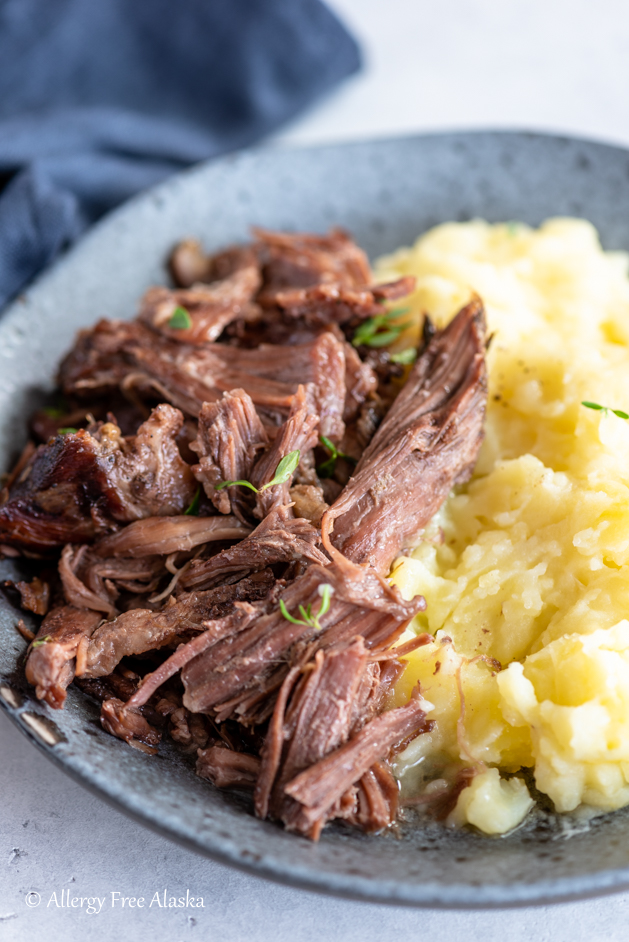 plate of instant pot chuck roast with mashed potatoes