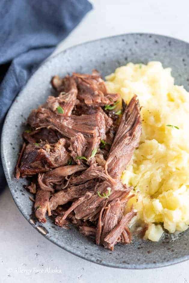 plate with chuck roast and mashed potatoes