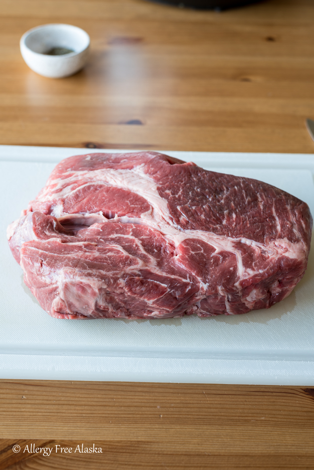 uncooked chuck roast on cutting board