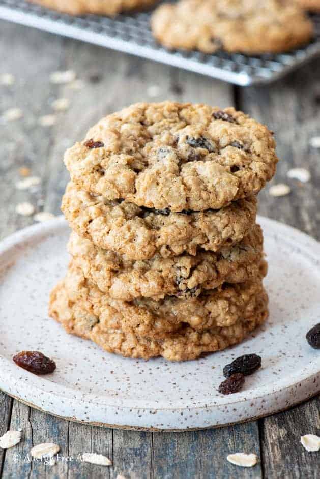 close up gluten-free oatmeal cookies stacked on plate 