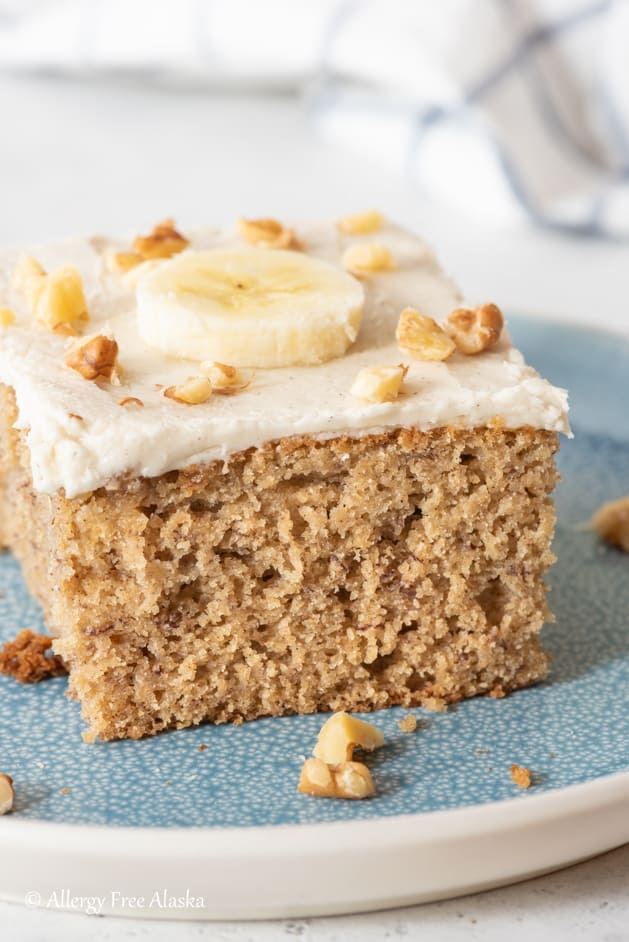 slice of gluten free dairy free banana cake sitting on blue plate