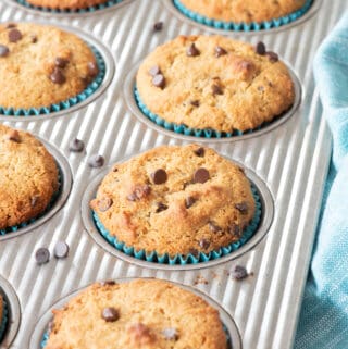 chocolate chip almond flour muffins sitting in metal muffin pan