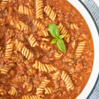 top down view of white dutch oven filled with dairy free lasagna soup