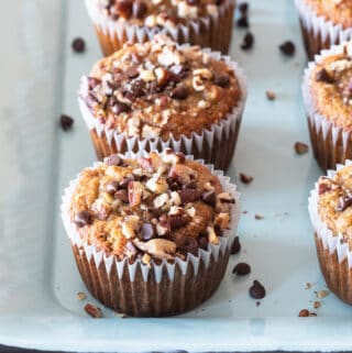 paleo banana muffins sitting on light blue metal pan