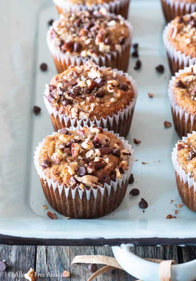 paleo banana muffins sitting on light blue metal pan