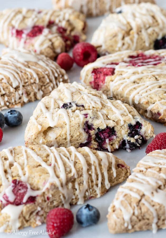 gluten free scones sitting on pastry board with berries