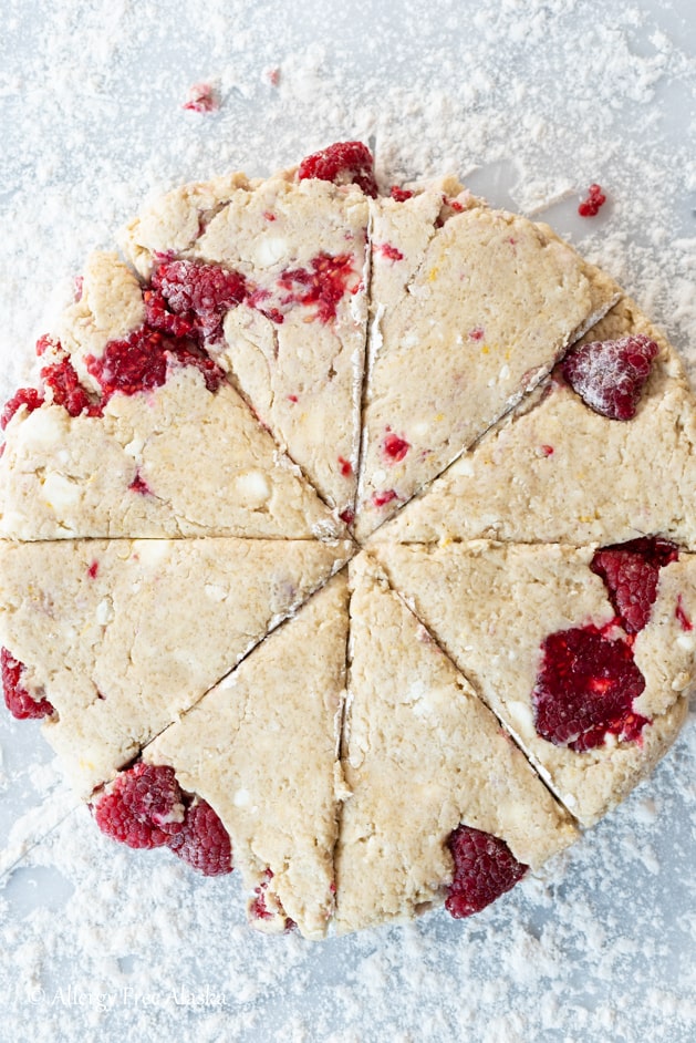 Top down view of raw gluten free scone dough cut into 8 triangles