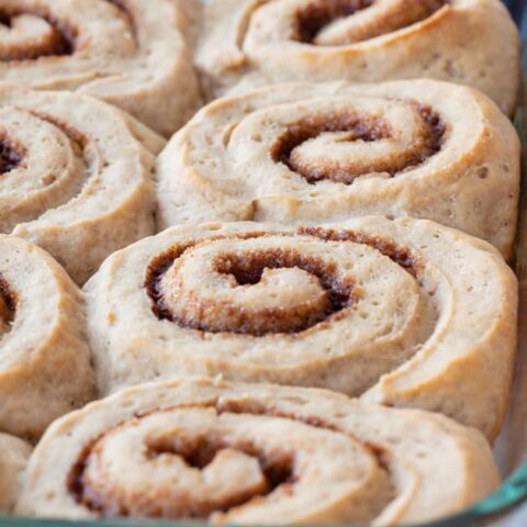 clear glass pan filled with baked gluten free cinnamon rolls